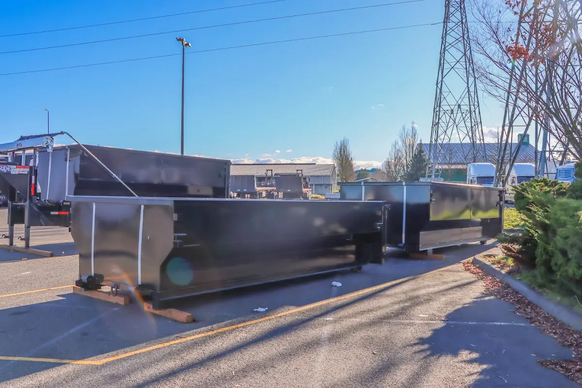 Roll-off dumpster ready for waste disposal at job site for 15 Yard Dumpster Rental in Webster